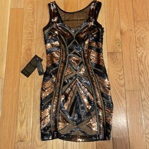 NWT Bebe black and gold sequins.  31 inches top to bottom. Size CX